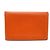 Monedero Calvi de Hermès en cuero de cabra naranja