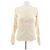 Top de lana Courreges beige de manga larga