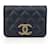Chanel Borsa a tracolla mini con patta e catena Nero