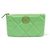 Chanel Pochette piccola in pelle di capra verde con logo in metallo dorato