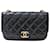 Chanel Mini borsa con patta e catena Nero