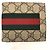 Portafoglio bi-fold Gucci in GG Supreme