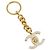 Llave CHANEL COCO de metal dorado CC Auth LNZ859V