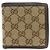 Portafoglio bi-fold Gucci in tela e pelle marrone
