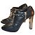 Botines Roberto Cavalli de cuero negro con tacón plateado