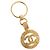 Chaveiro CHANEL em metal dourado CC Auth bs35092M