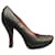 Alaïa Pumps aus goldenem Pythonleder