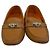 Hermès Mocassins de couro marrom com fivela prateada