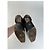 Mocassini vintage Gucci in pelle nera con l'iconico logo GG Nero - vista 3