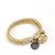 Bottega Veneta Bracciale charm rotondo in pelle intrecciata e metallo dorato D'oro