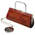 Autre Marque Braune Clutch aus geprägtem Pythonleder mit Griff