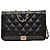 Portafoglio Chanel Boy in caviar trapuntato nero con catena