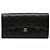 Cartera larga Chanel Black Quilted Caviar Classic Flap Negro