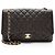 Gabrielle Borsa Chanel Classic Maxi Single Flap in pelle Caviar Marrone