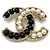Broche de mujer Chanel en negro, dorado y blanco
