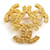 Spilla in metallo dorato Chanel D'oro