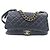 Chanel Borsa a mano e a spalla in pelle caviar con catena Nero