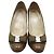 Salvatore Ferragamo Patentleder-Pumps mit silberner Schleife Braun