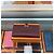 Hermès Lange Brieftasche Beige mit Goldprägung - Geschenk Rot - Ansicht 3