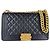 Bolso bandolera Boy de Chanel en piel de becerro granulado negro