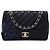 Chanel Mini borsa a tracolla con patta in pelle di agnello e catena dorata Nero