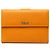 Cartera bifold de piel de becerro texturizada naranja Gucci