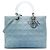 Lady Dior in denim blu grande con manici in acrilico Cannage di Dior Blu chiaro
