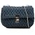 Borsa Miu Miu in denim matelassé blu con catena di cristalli