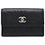 Tarjetero Chanel CC de piel gofrada negra con Camelia Negro