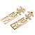 Orecchini Boy Swing in ottone e strass con CC Chanel dorati D'oro