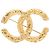 Spilla Chanel CC placcata oro con rilievo barocco D'oro