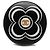 Anello Chanel in resina nera e metallo dorato con logo CC e camelia Nero