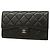 Portafoglio lungo tri-fold Chanel in nappa nera Nero