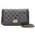 Chanel Borsa a tracolla WOC in pelle di agnello trapuntata con catena dorata Nero