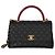 Gabrielle Borsa Chanel Medium Coco Top Handle in pelle caviar matelassé nera e lucertola Nero