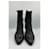 Botas de cano curto em couro preto de bico fino Prada  - vista 4