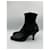 Botas de cano curto em couro preto de bico fino Prada  - vista 6