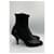Botas de cano curto em couro preto de bico fino Prada  - vista 7
