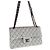 Timeless Borsa a patta Chanel Classic in tweed bianco e nero
