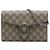 Portafoglio con catena Gucci Beige GG Supreme Dionysus