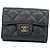 Portafoglio tri-fold Chanel in nero
