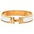 Bracciale Clic H PM stretto in smalto dorato Hermès D'oro