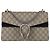Borsa a tracolla Small Dionysus Gucci in tela GG Supreme beige/nero e camoscio
