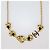 Collana Chanel in metallo dorato e resina nera con cuori e logo CC D'oro - vista 3
