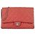 Chanel Clutch On Chain Classic Flap in pelle caviar matelassé rossa Rosa