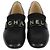Mocassini Chanel in pelle lucida nera con logo Nero