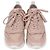 Sneakers basse Tod's in pelle traforata rosa con frange e nappe