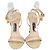 Tom Ford Riemchensandalen mit Vorhängeschloss aus cremefarbenem Lackleder