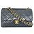 Borsa a tracolla Chanel Double Flap in pelle d'agnello nera con catena Nero