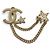Spilla Chanel in metallo dorato Coco Mark Star con catena e strass D'oro